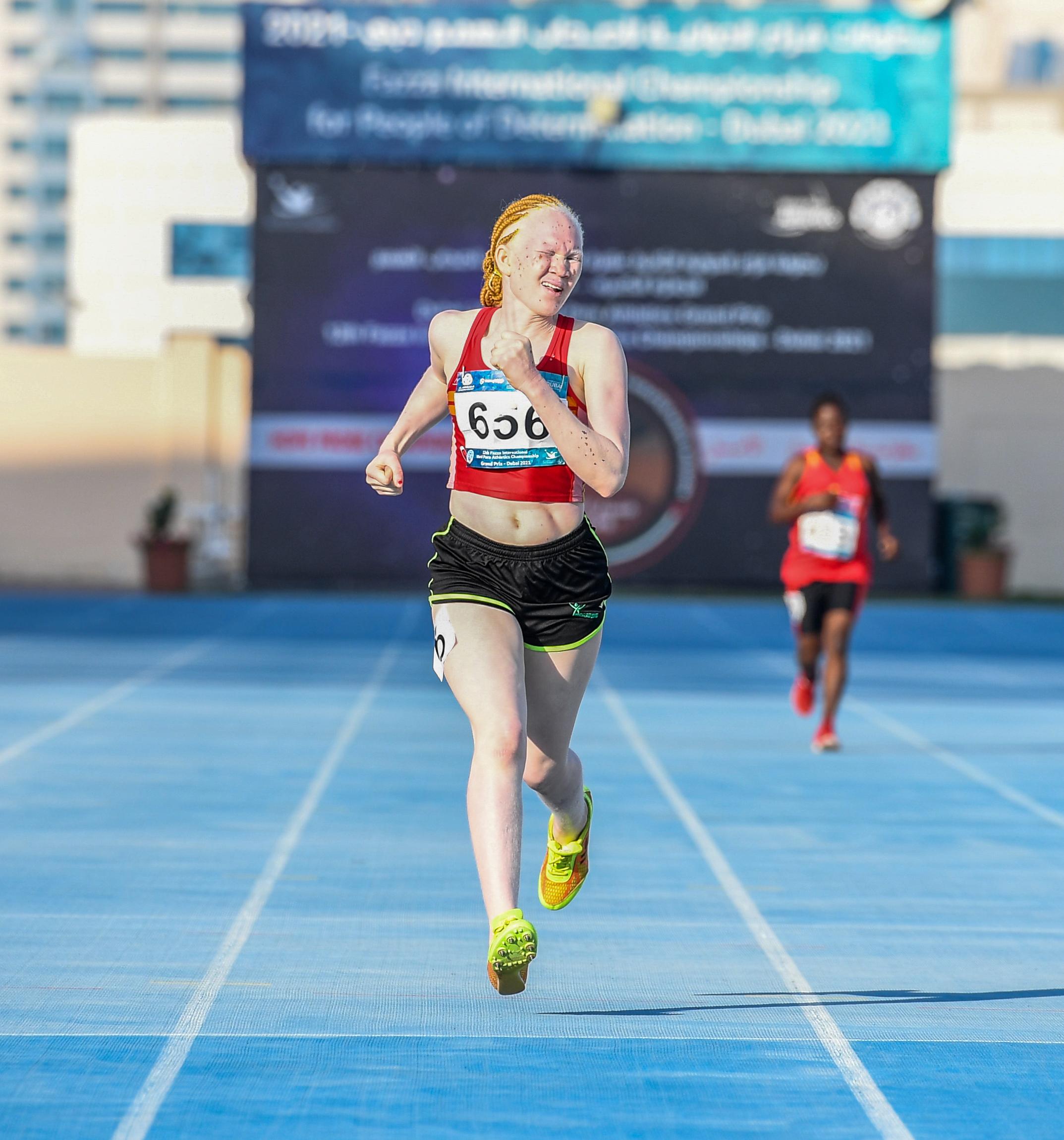 Monica Munga, a Para athlete from Zambia running on a blue track Cover Image