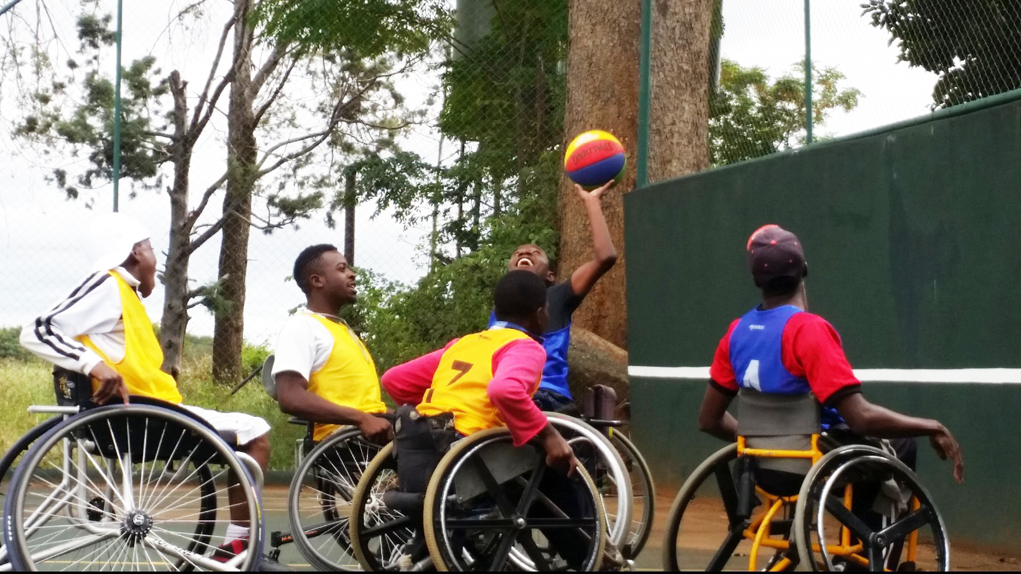A group of wheelchair athletes playing basketball. Photo credit: NM Foundation Trust Zimbabwe. Cover Image