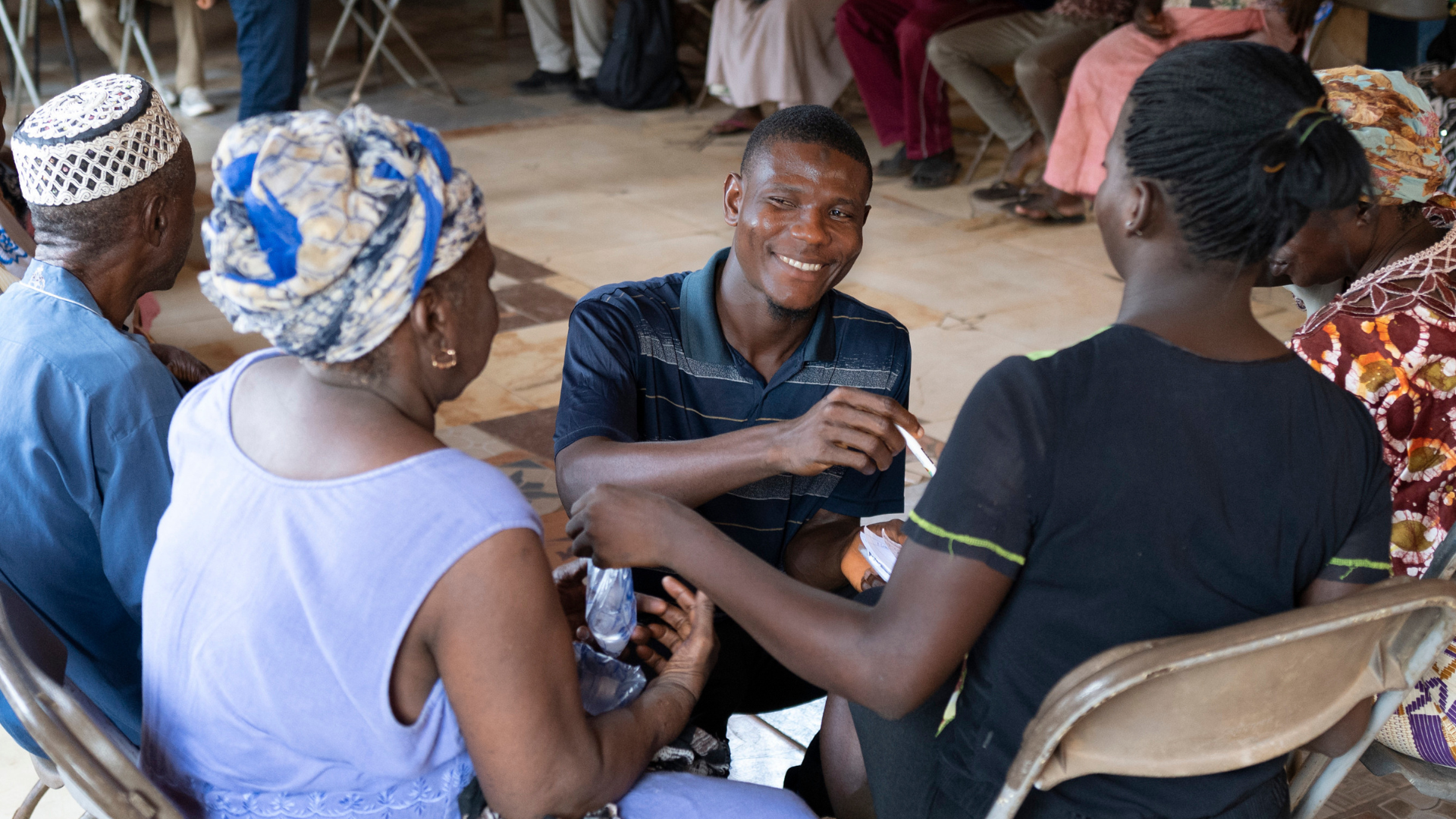 Image of workshop discussion - with participants sitting in a small huddle Cover Image