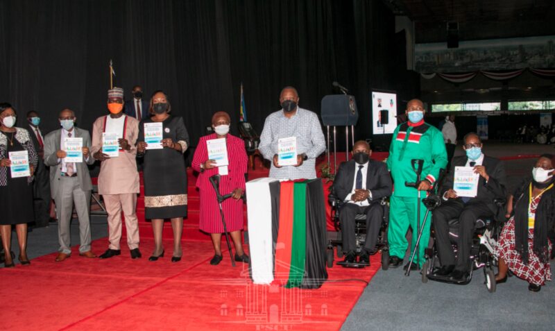 The President and other panelists stand in a row for a photograph Cover Image