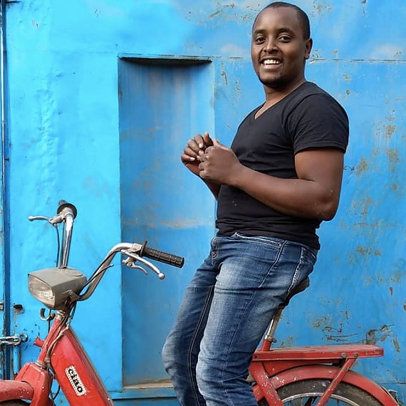 Lincoln Wamae in one of his scooters Cover Image