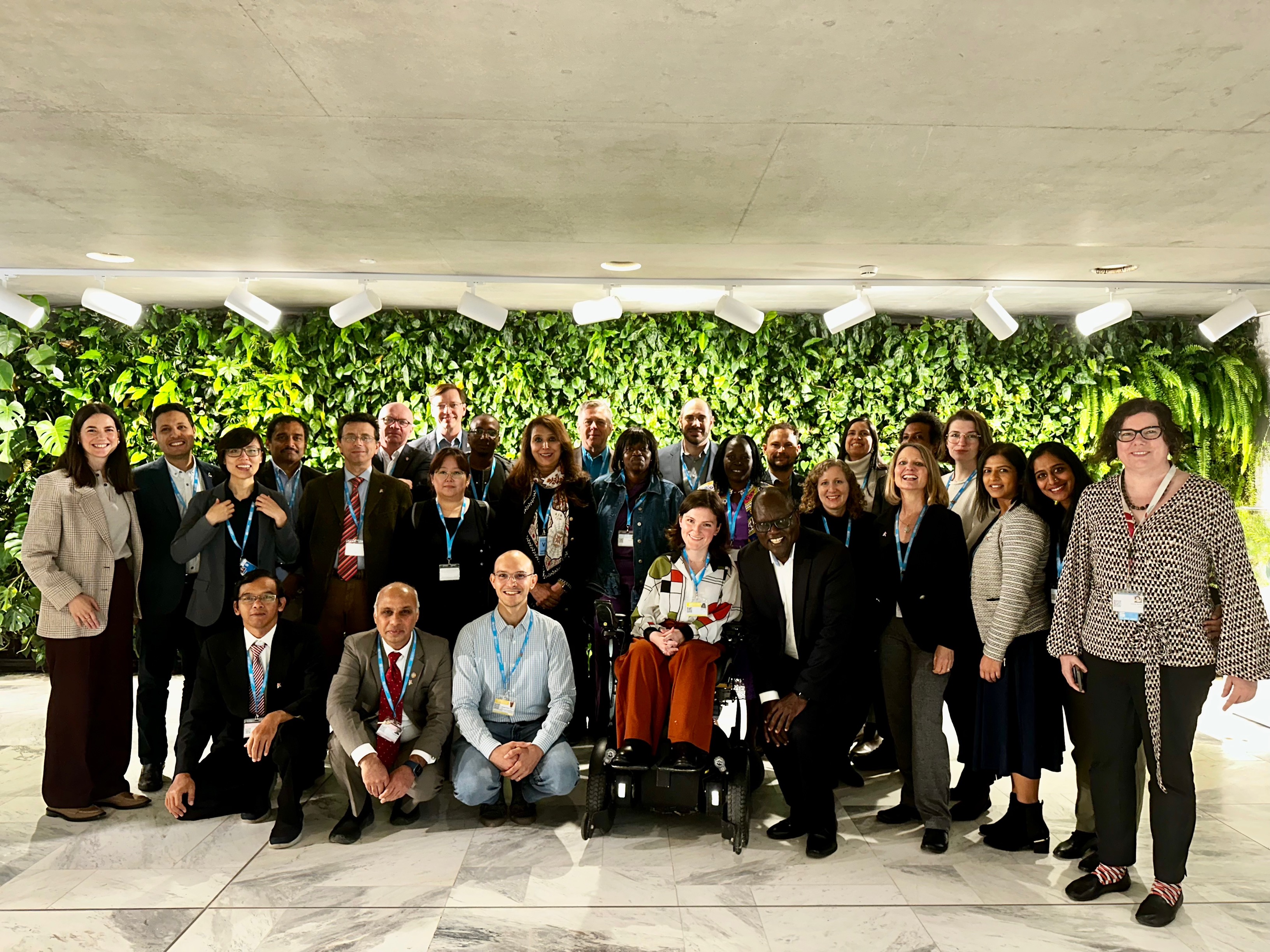 A group of people pose together outside Cover Image