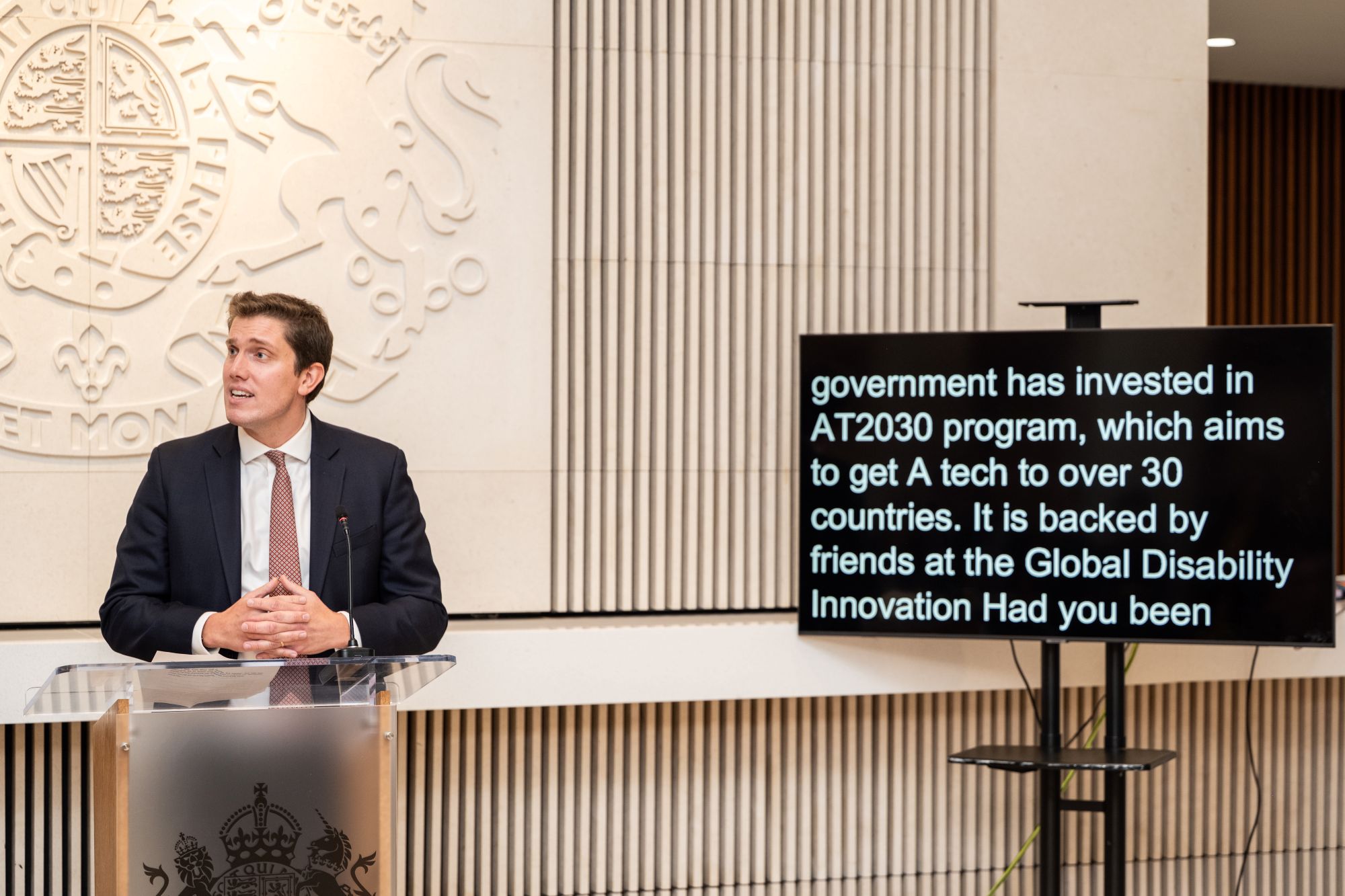 Reception in Washington, with representative of UK government speaking on stage Cover Image