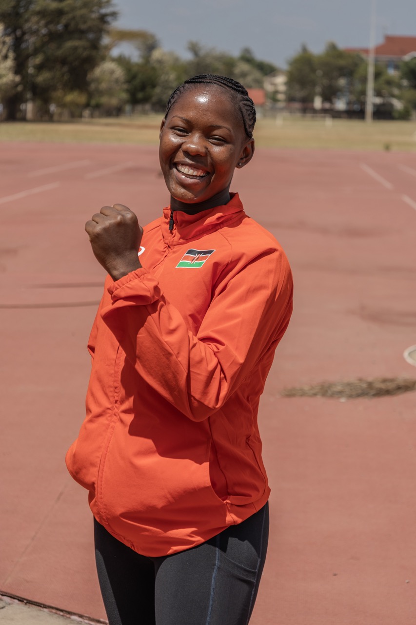 Stency smiling at the camera s she trains in the track