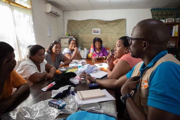 A group of people sitting around a table
