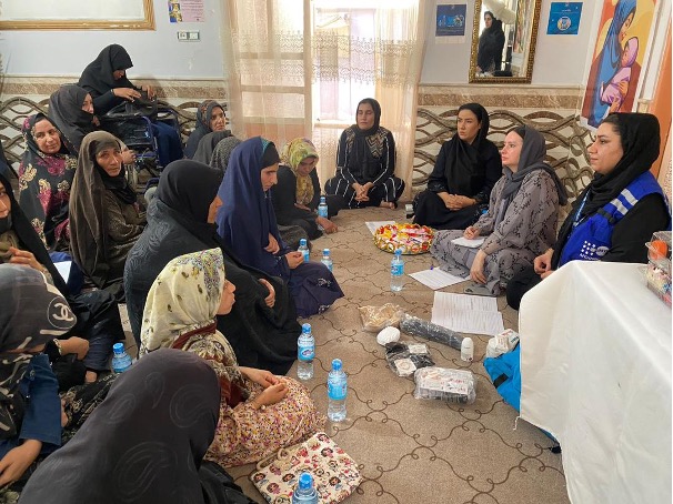 A group of women sitting in a circle