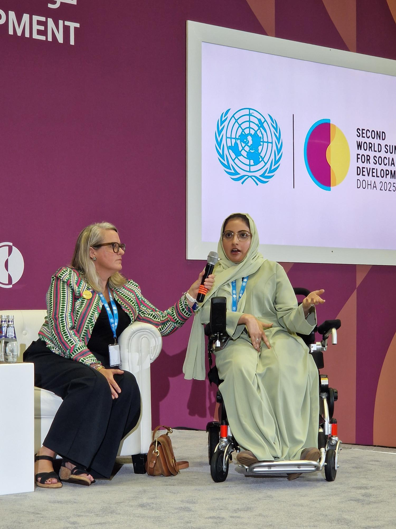 Ceridwen from aTScale holding the microphone for Fatma during the session