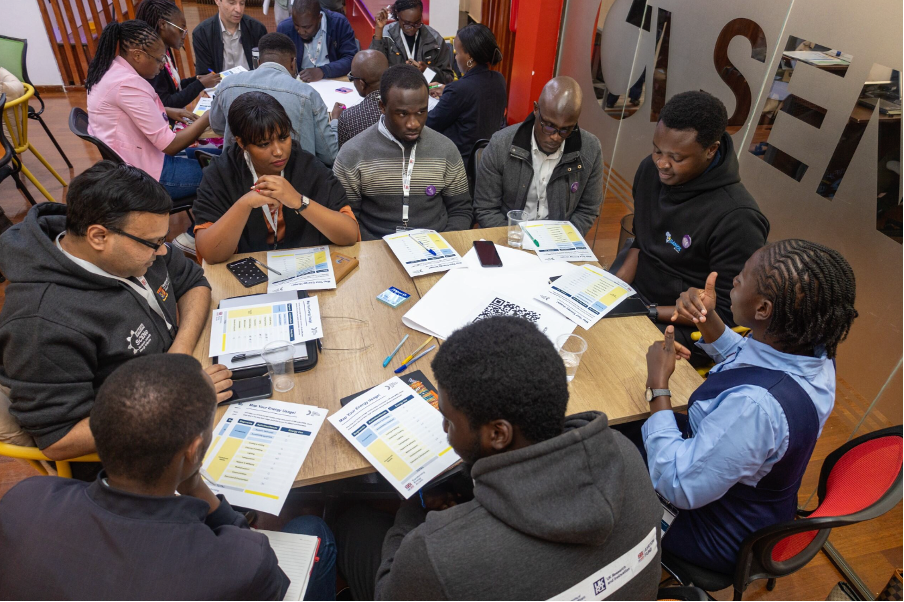 Participants at the co-design workshop working in small groups for mapping energy needs and usage