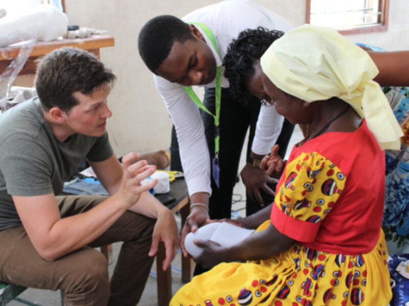 Technicians during a prostheses fitting. Cover Image